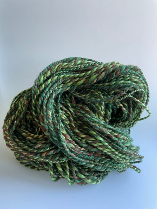 il_fullxfull.4642380958_kt2h.jpg Hand spun Shetland yarn combined with merino and sari silk in forest greens.