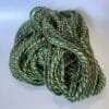 il_fullxfull.4642380992_lcgx.jpg Hand spun Shetland yarn combined with merino and sari silk in forest greens.
