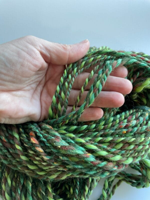 il_fullxfull.4642381178_m855.jpg Hand spun Shetland yarn combined with merino and sari silk in forest greens.