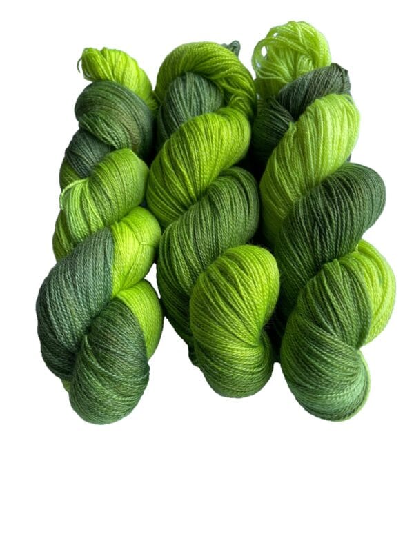 Soft, hand dyed, lace weight yarn. Superwash, non-mulesed Merino and bamboo. Pooling avacado green with fluorescent chartreuse stripes.