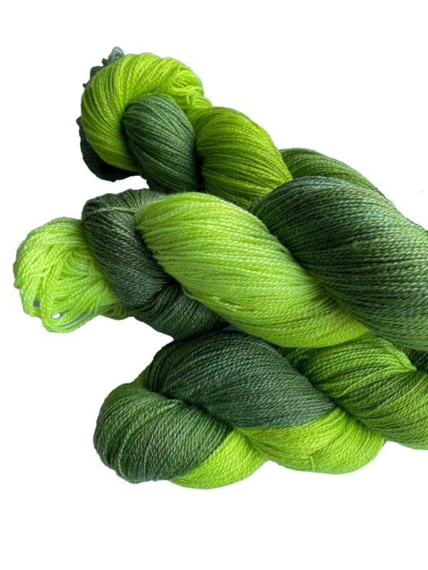 Soft, hand dyed, lace weight yarn. Superwash, non-mulesed Merino and bamboo. Pooling avacado green with fluorescent chartreuse stripes.