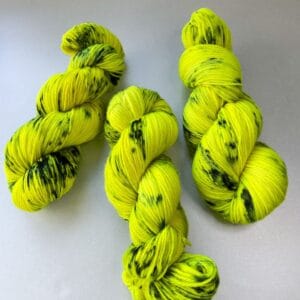 il_fullxfull.5864610942_lr8w.Jpg Hand-dyed Superwash DK Weight Yarn 'Biohazard'. Fluorescent Yellow with Steel Blue Speckles.