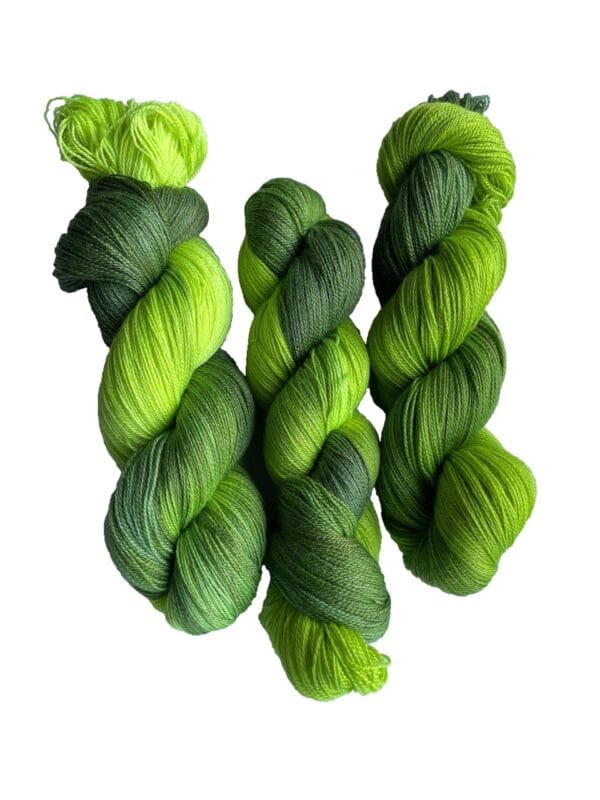 Soft, hand dyed, lace weight yarn. Superwash, non-mulesed Merino and bamboo. Pooling avacado green with fluorescent chartreuse stripes.